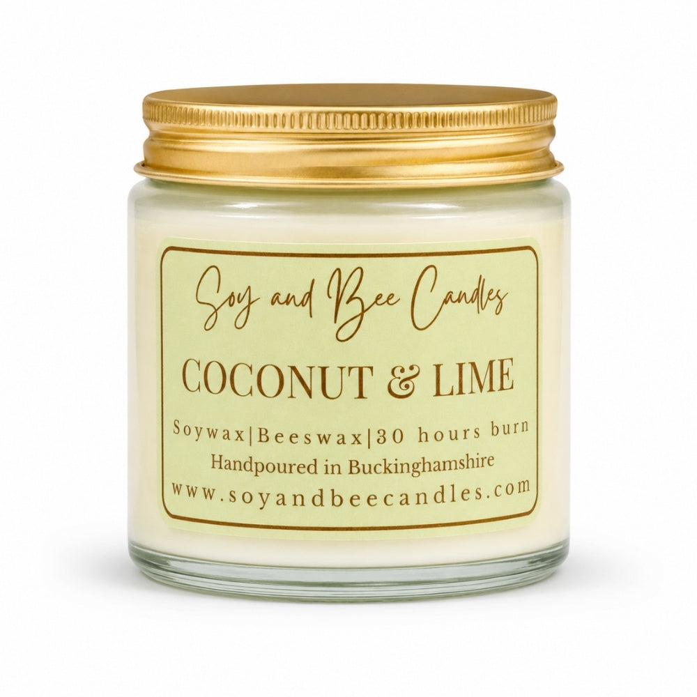 Coconut & Lime candle with gold lid and label on a white background