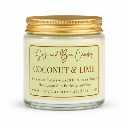 Coconut & Lime candle with gold lid and label on a white background