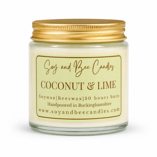 Coconut & Lime candle with gold lid and label on a white background