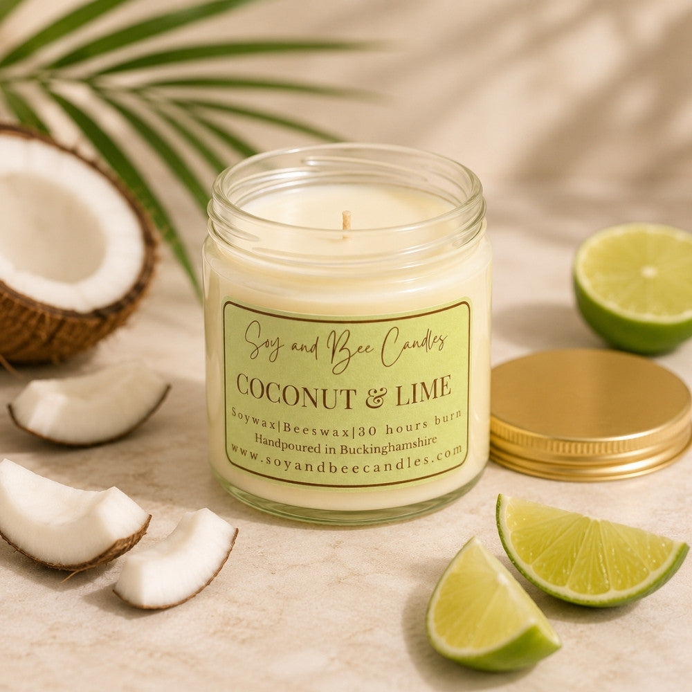 Coconut and lime scented candle with coconut and lime slices on a neutral background