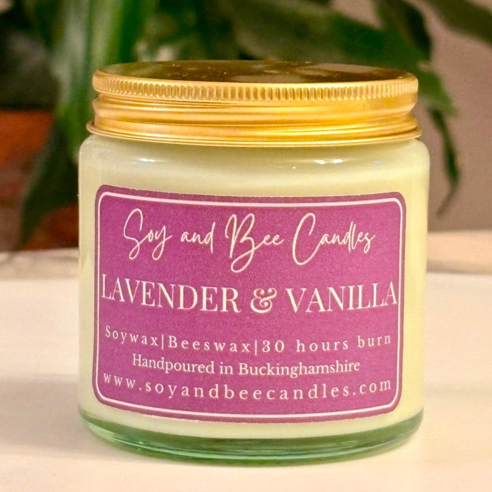 Soy and Bee Candles lavender and vanilla candle with a gold lid on a neutral background