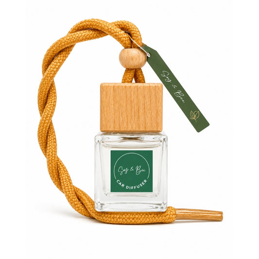 Car diffuser with wooden cap and orange cord on a white background