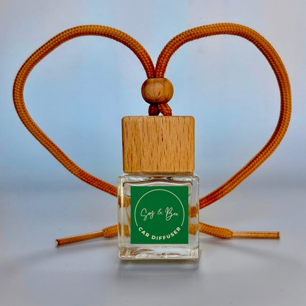 Car diffuser with wooden top and green label on a light background
