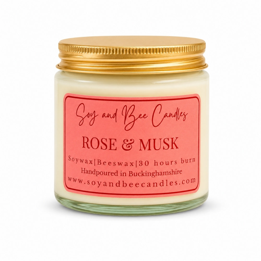 Soy and Bee Candles rose & musk candle with a gold lid on a white background